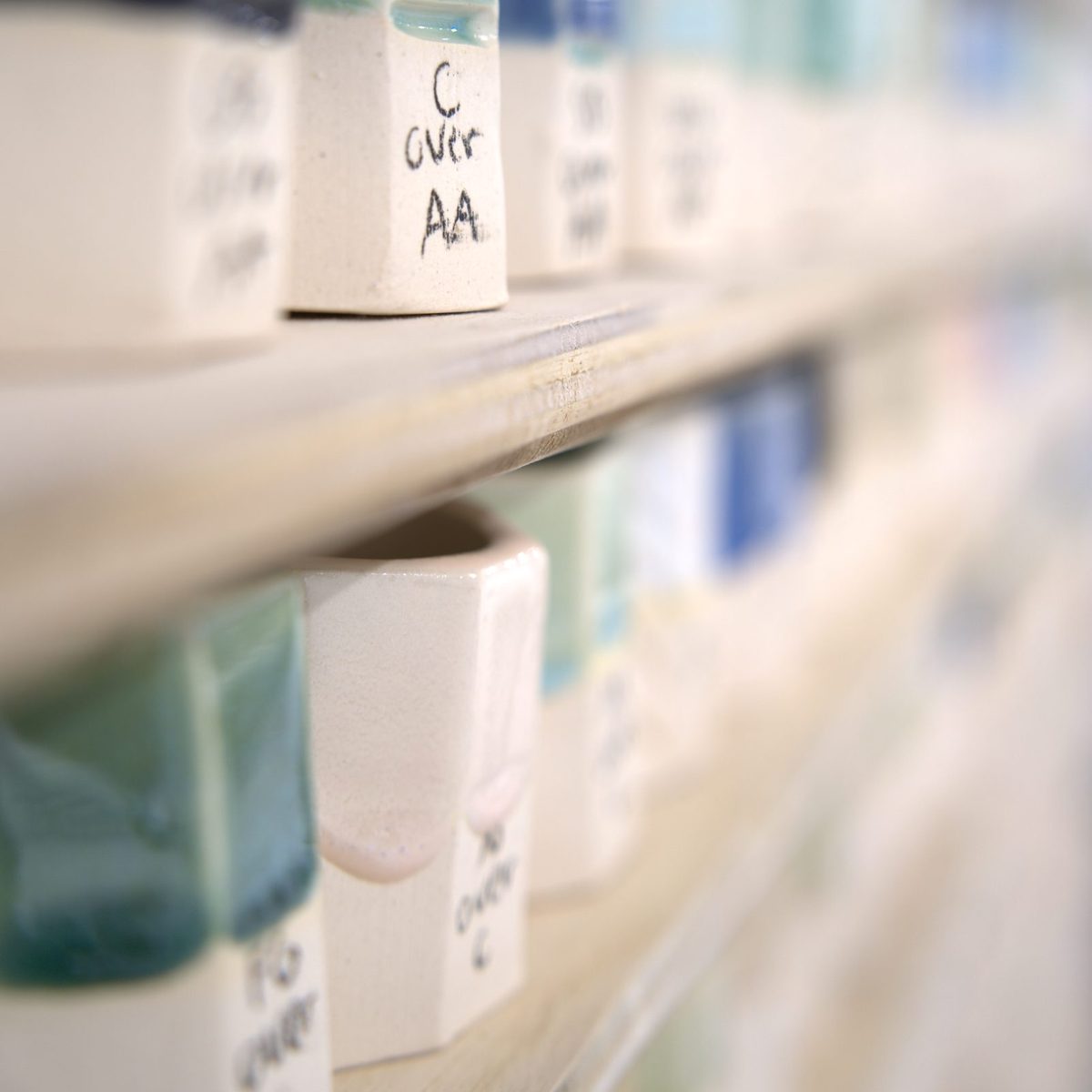 Wall of glaze test tiles at Claya pottery studio in RiNo, Denver