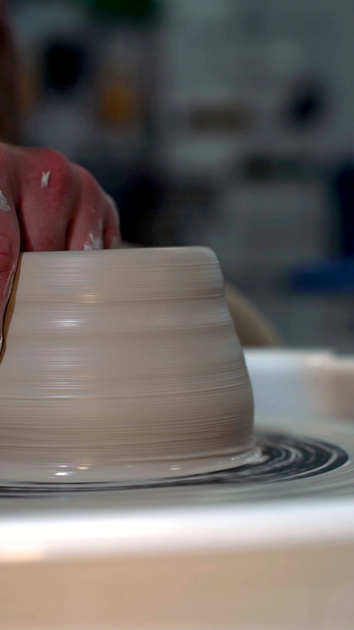 A freshly thrown pot spinning on the wheel at Claya pottery studio in RiNo, Denver