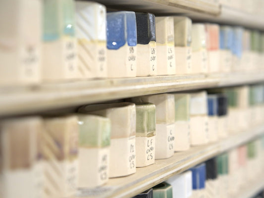Shelves of glaze test tiles at Claya pottery studio in RiNo, Denver