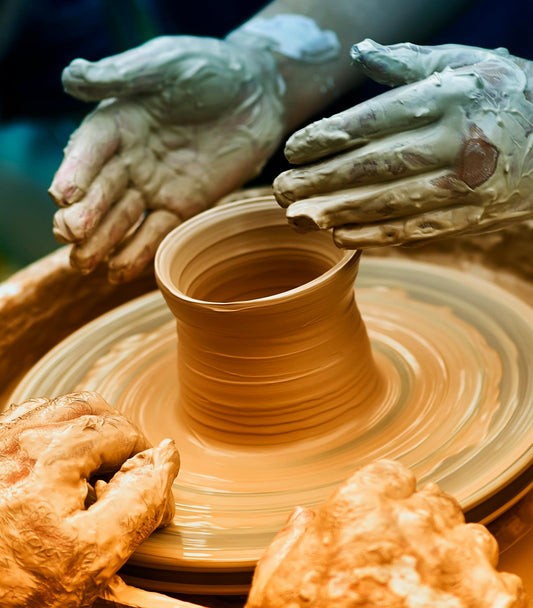 People learning pottery wheel throwing together