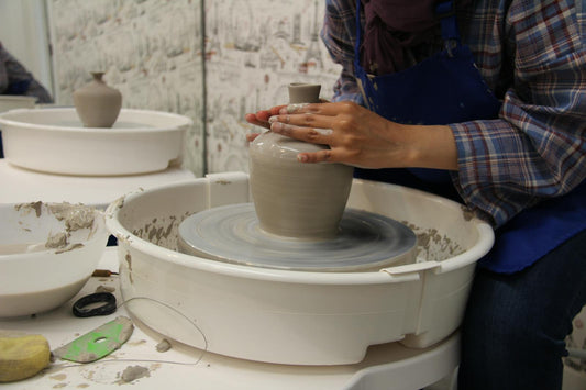 Pottery studio interior with wheel and clay