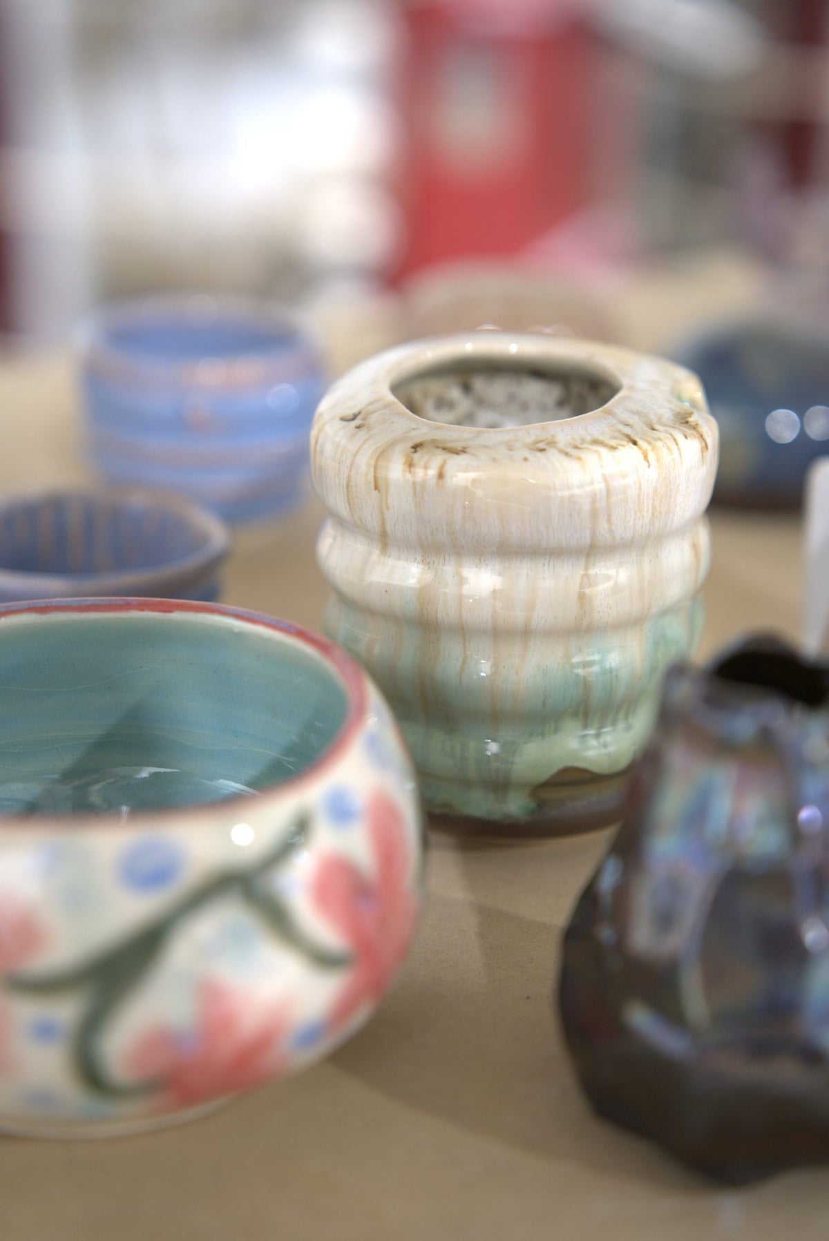 Finished glazed bowls and vases made at Claya pottery studio, RiNo Denver