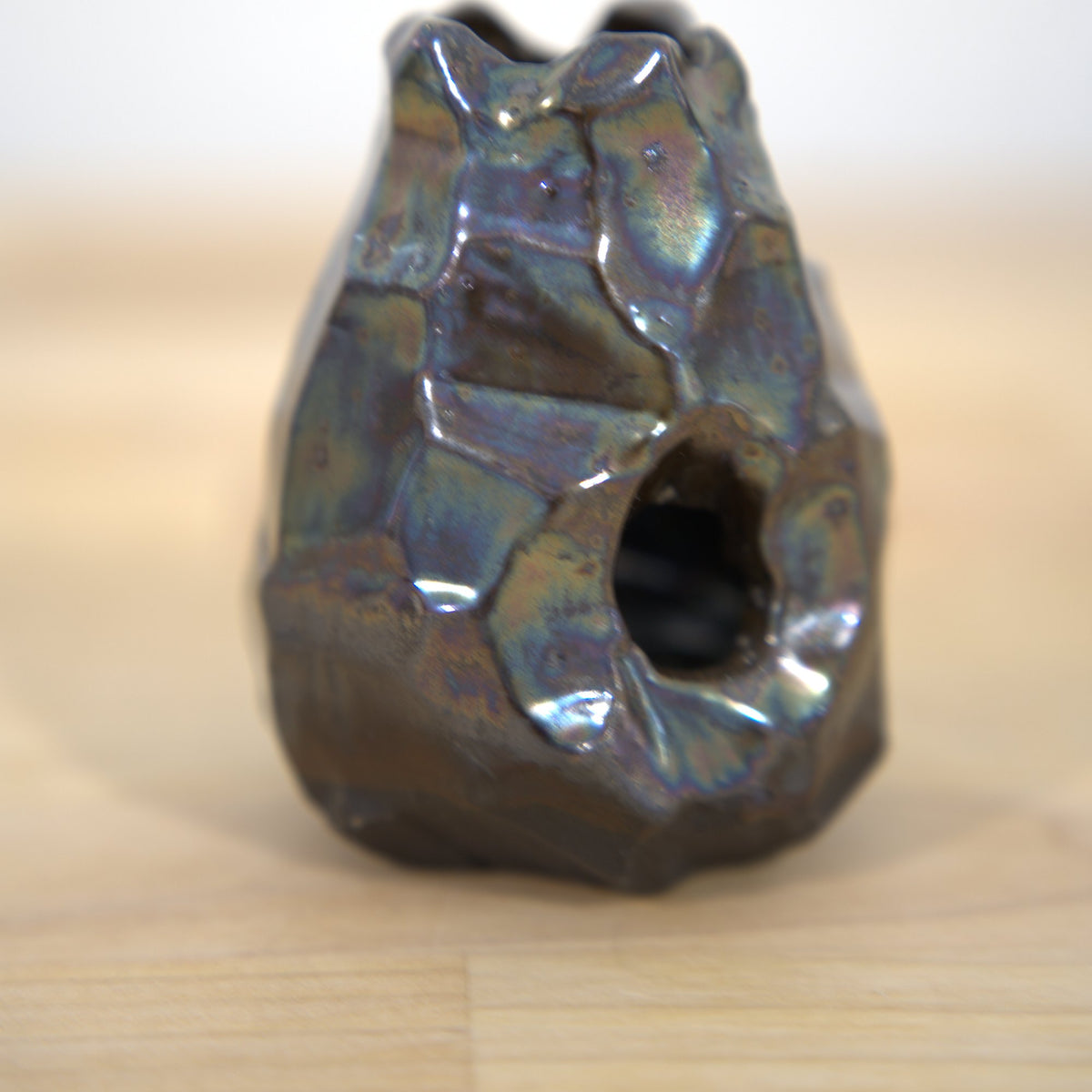 Iridescent glazed altered vessel made at Claya Studios in RiNo, Denver