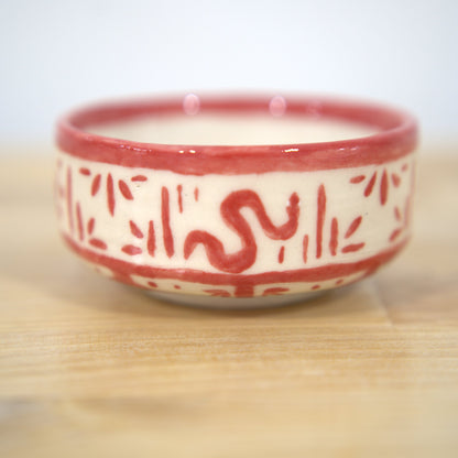 Red hand-painted ceramic bowl made at Claya Studios in RiNo, Denver