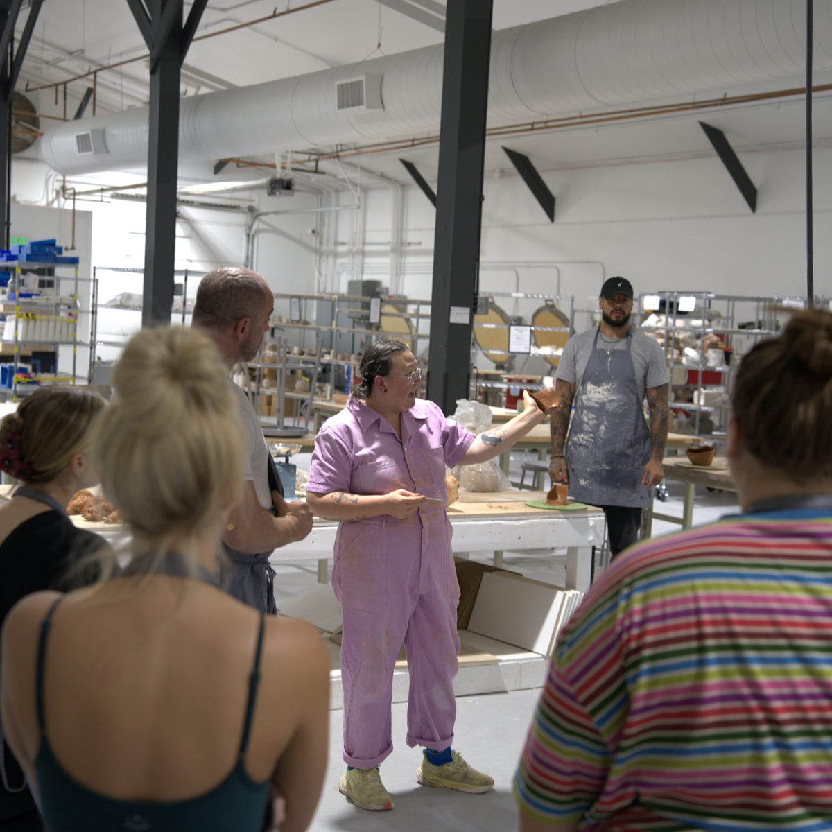 Instructor Caitlin walking students through the wheel class at Claya Studios in RiNo, Denver