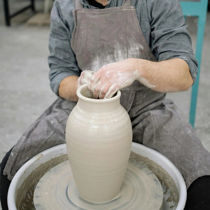Potter throws a bowl at Claya pottery studio Denver and ceramics studio in Denver, Colorado